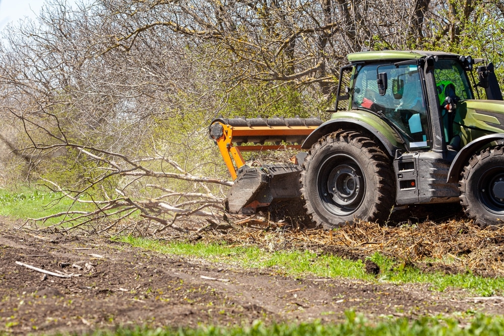 picture,of,a,tractor,specialized,in,forest,clearing,that,is